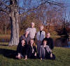 family group by a pond